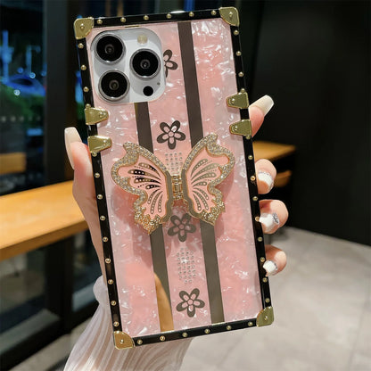 Elegant butterfly diamond iPhone case with sparkling crystal accents, designed to protect your phone while adding a touch of glamour.